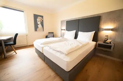 Ein Bett oder Betten in einem Zimmer der Unterkunft Das Reinisch Just Rooms