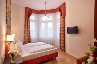 Ein Bett oder Betten in einem Zimmer der Unterkunft Hotel Johann Strauss