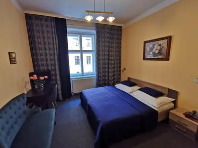 Ein Bett oder Betten in einem Zimmer der Unterkunft Hotel Bajazzo