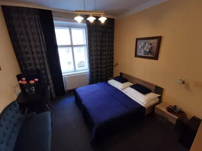 Ein Bett oder Betten in einem Zimmer der Unterkunft Hotel Bajazzo