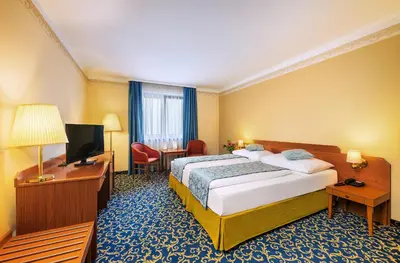 Ein Bett oder Betten in einem Zimmer der Unterkunft Hotel Bellevue Wien