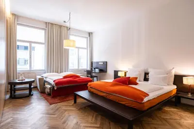 Ein Bett oder Betten in einem Zimmer der Unterkunft Buxbaum Beletage Design & Boutique Hotel