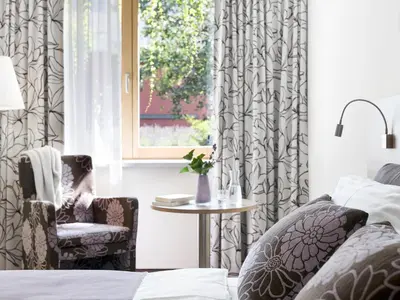 Ein Bett oder Betten in einem Zimmer der Unterkunft Boutiquehotel Stadthalle by Cocoon