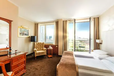 Ein Bett oder Betten in einem Zimmer der Unterkunft Hotel Am Parkring