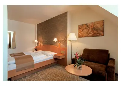 Ein Bett oder Betten in einem Zimmer der Unterkunft Club Hotel Cortina