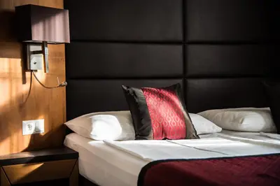 Ein Bett oder Betten in einem Zimmer der Unterkunft Club Hotel Cortina