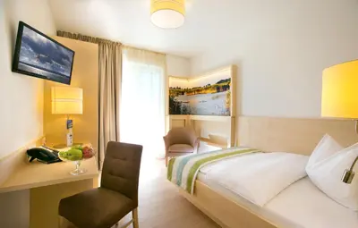 Ein Bett oder Betten in einem Zimmer der Unterkunft Hotel Wende