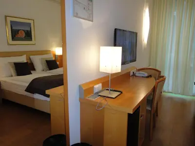 Ein Bett oder Betten in einem Zimmer der Unterkunft City Hotel Albrecht