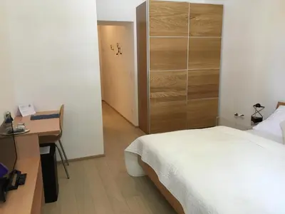Ein Bett oder Betten in einem Zimmer der Unterkunft Hotel Wiener Kindl