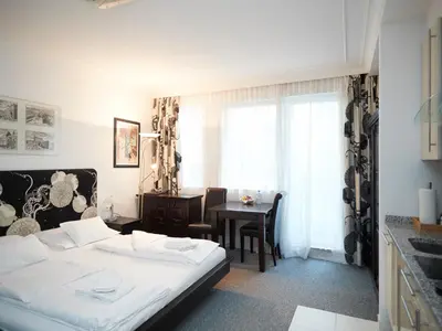 Ein Bett oder Betten in einem Zimmer der Unterkunft La Scala Apartments