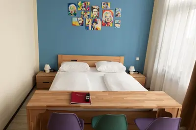 Ein Bett oder Betten in einem Zimmer der Unterkunft Pension a und a