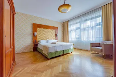 Ein Bett oder Betten in einem Zimmer der Unterkunft Hotel Josefshof am Rathaus