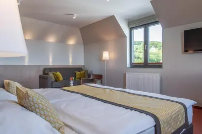Ein Bett oder Betten in einem Zimmer der Unterkunft Hotel Turmhof