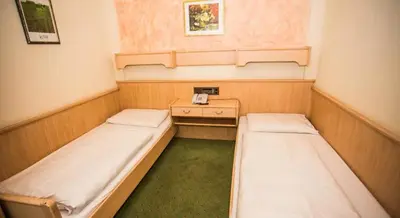 Ein Bett oder Betten in einem Zimmer der Unterkunft Hotel Hadrigan