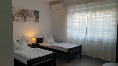 Ein Bett oder Betten in einem Zimmer der Unterkunft Pension Diana-Parndorf