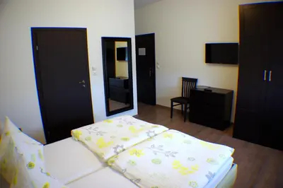 Ein Bett oder Betten in einem Zimmer der Unterkunft Pension Diana-Parndorf