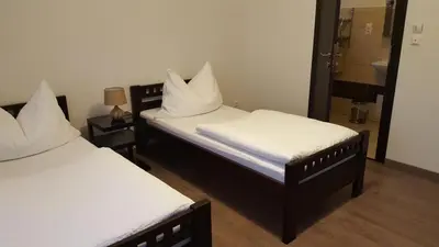 Ein Bett oder Betten in einem Zimmer der Unterkunft Pension Diana-Parndorf