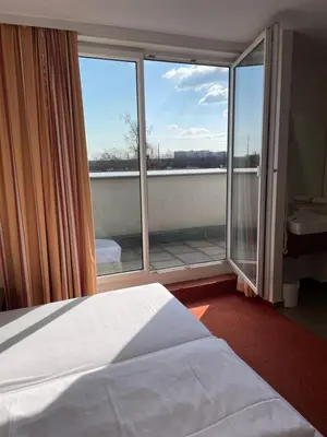 Ein Bett oder Betten in einem Zimmer der Unterkunft Hahn Hotel Vienna
