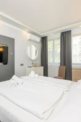 Ein Bett oder Betten in einem Zimmer der Unterkunft Palais Pálffy Apartments Vienna