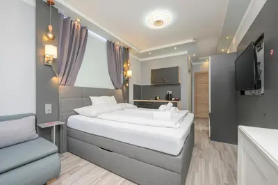 Ein Bett oder Betten in einem Zimmer der Unterkunft Palais Pálffy Apartments Vienna