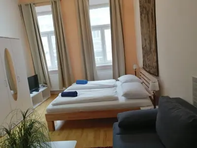 Ein Bett oder Betten in einem Zimmer der Unterkunft Vienna Comfort Apartments - Borschkegasse 12