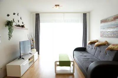 Ein Sitzbereich in der Unterkunft Modern Danube Apartment Vienna