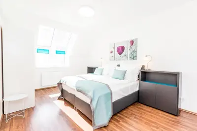 Ein Bett oder Betten in einem Zimmer der Unterkunft Simtown Suite Apartments