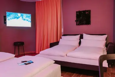 Ein Bett oder Betten in einem Zimmer der Unterkunft Rioca Vienna Posto 2