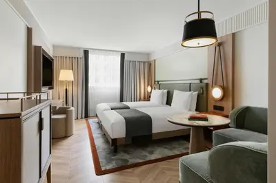 Ein Bett oder Betten in einem Zimmer der Unterkunft Imperial Riding School, Autograph Collection