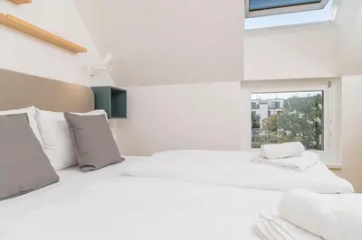 Ein Bett oder Betten in einem Zimmer der Unterkunft Micro Rooftop Penzing