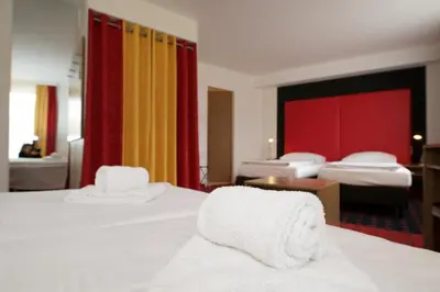 Ein Bett oder Betten in einem Zimmer der Unterkunft Senator Hotel Vienna