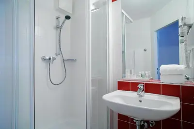 Ein Badezimmer in der Unterkunft Senator Hotel Vienna
