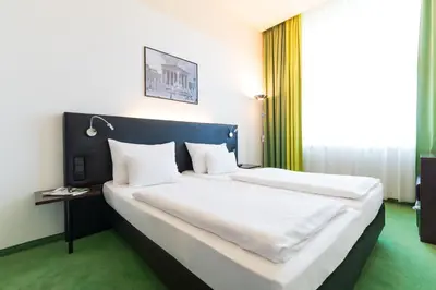 Ein Bett oder Betten in einem Zimmer der Unterkunft Rainers Hotel Vienna