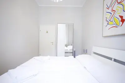 Ein Bett oder Betten in einem Zimmer der Unterkunft HeyMi Apartments Karlsplatz