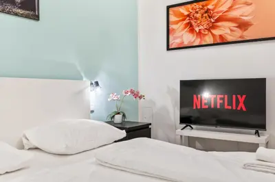 Ein Bett oder Betten in einem Zimmer der Unterkunft 522 Mbits Wifi Air Con Free Parking