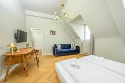 Ein Bett oder Betten in einem Zimmer der Unterkunft Palais Palffy Suits