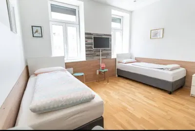 Ein Bett oder Betten in einem Zimmer der Unterkunft Comfortable Apartments Vienna 1100 with contactless Check-in