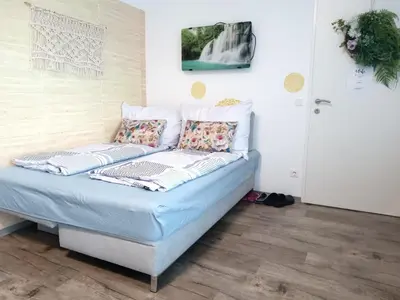 Ein Bett oder Betten in einem Zimmer der Unterkunft Ferienzimmer Seepark