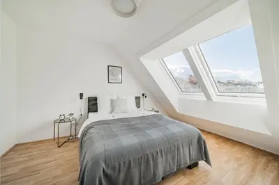 Ein Bett oder Betten in einem Zimmer der Unterkunft Arbio I Liv's Place Lux Apartments