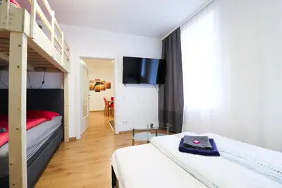Ein Bett oder Betten in einem Zimmer der Unterkunft CozyNite Premium Apartment Schönbrunn 1