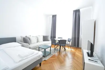 Ein Bett oder Betten in einem Zimmer der Unterkunft UNIVERSUM APARTMENT 4