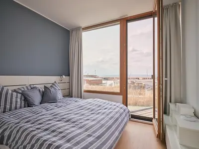 Ein Bett oder Betten in einem Zimmer der Unterkunft Exklusives Ferienhaus - Direkt am Neusiedler See