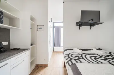Ein Bett oder Betten in einem Zimmer der Unterkunft City Center Lofts