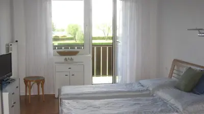 Ein Bett oder Betten in einem Zimmer der Unterkunft Appartement am Strand