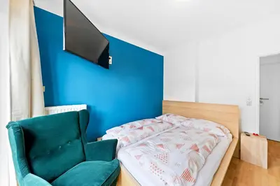 Ein Bett oder Betten in einem Zimmer der Unterkunft Flora Collection