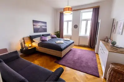 Ein Bett oder Betten in einem Zimmer der Unterkunft Wonderful apartment close to City Centre With Porch
