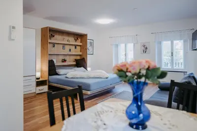 Ein Bett oder Betten in einem Zimmer der Unterkunft Schloss-Appartements