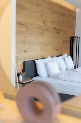Ein Bett oder Betten in einem Zimmer der Unterkunft geislerAPPARTMENTS