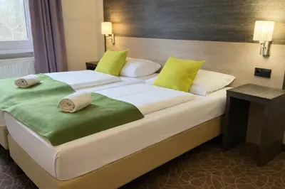 Ein Bett oder Betten in einem Zimmer der Unterkunft 24hours Apartment Hotel