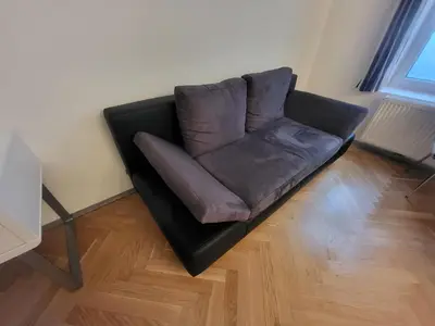 Ein Sitzbereich in der Unterkunft CozyNite Premium Apartment Hundertwasser